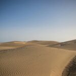 Serene view of the vast sand dunes at Maspalomas, a natural wonder in Gran Canaria, Spain.